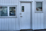 There was an overhead door in this opening originally, then removed, the opening framed in and this hollow metal door and 2 windows installed.
